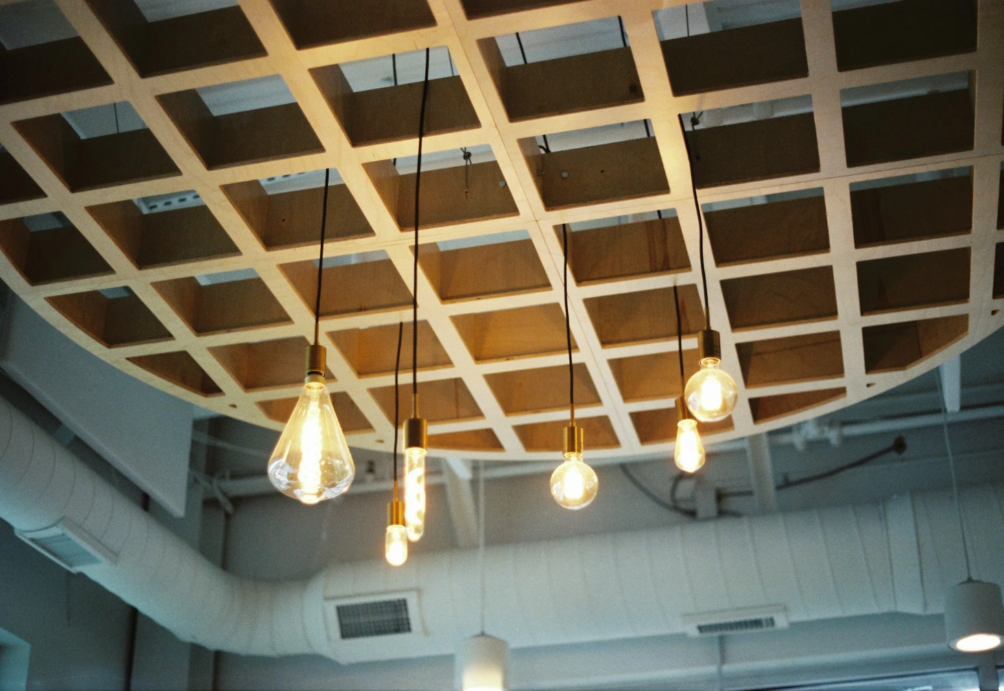 a group of light bulbs hanging from a ceiling